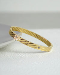 Golden Twirl CZ Bangle