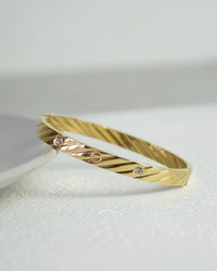 Golden Twirl CZ Bangle