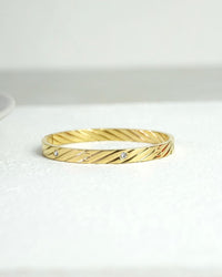 Golden Twirl CZ Bangle